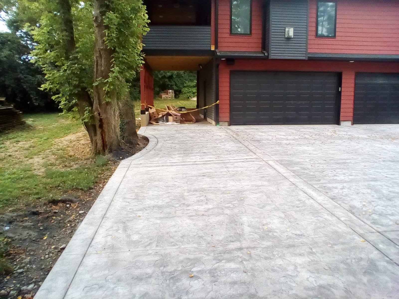 Decorative stamped concrete driveway completed by 3D Renovations