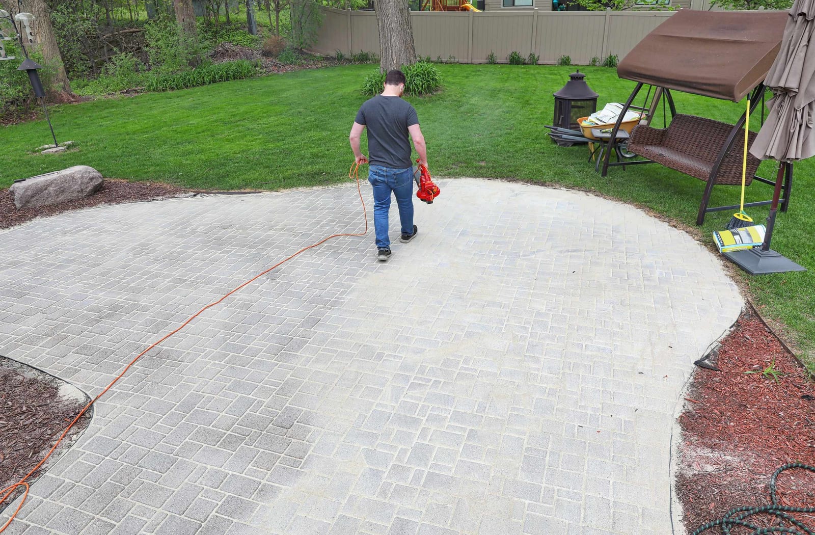 Circular paver patio in a finished backyard